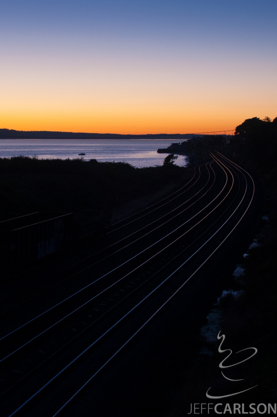 Sunset reflected off railroad tracks, Richmond Beach, WA.